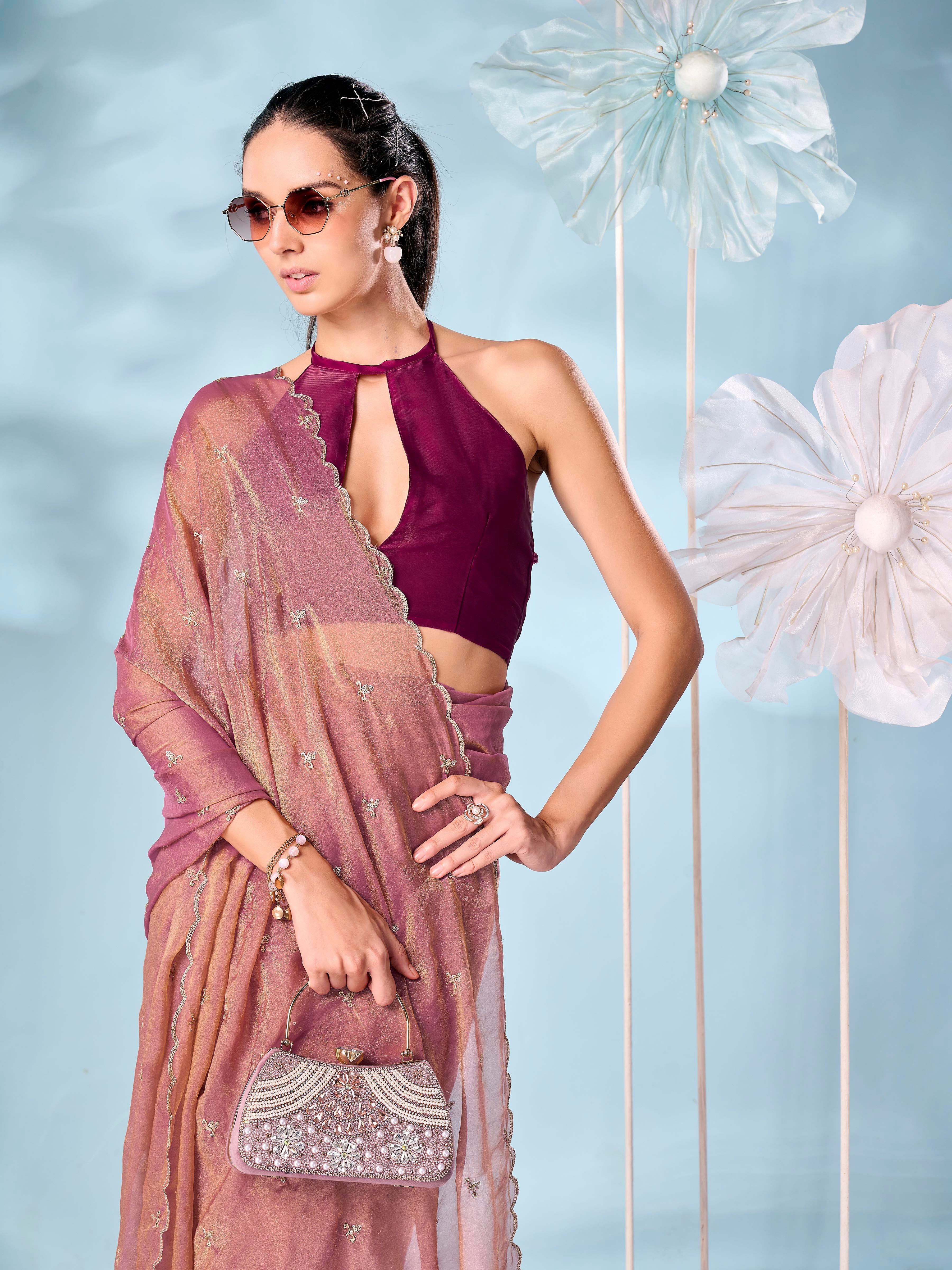 Rust colored sequinned butti shimmer saree with scalloped border